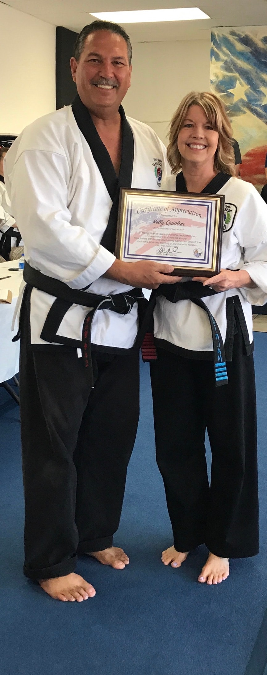 Instructor presenting Certificate of Appreciation to student